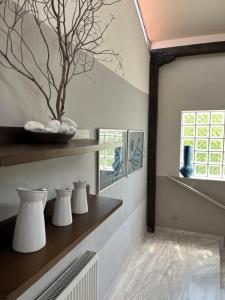 a living room with white walls and a window at palazzo PADINI alla costa in Neoi Epivates +25 photos