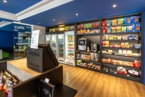 a grocery store store with a food aisle with food at ibis budget Curitiba Centro in Curitiba