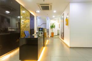 a lobby with a reception desk in a building at Hotel Zona Express San Diego in Medellín