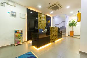 a lobby with a counter with lights on it at Hotel Zona Express San Diego in Medellín