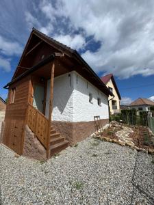a small house with a door on the side of it at Chalupa Daša-tiny house in Trstené