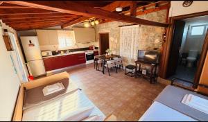 an overhead view of a kitchen with a table and chairs at campo villa in Mesimvría +12 photos