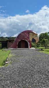 a building with a head of a chicken on it at Animal Glamping in Pomona