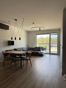 TV a/nebo společenská místnost v ubytování Pine Apartment