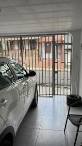 a car parked in front of a large window at El Encanto Alajuela in Alajuela