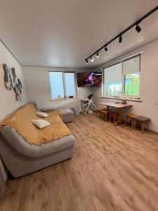 a bedroom with a bed and a table in it at Дача на Каролина бугазе in Zatoka