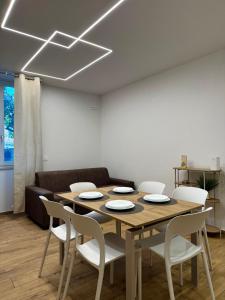 a dining room with a table and chairs at FraDom House in Montesilvano +13 photos