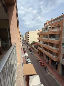 a view of a city street from a balcony at Big vacation apartment BI in Guardamar del Segura