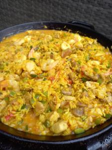 a pan filled with rice and meat and vegetables at B&B RhinoSauna in Vihti +44 photos