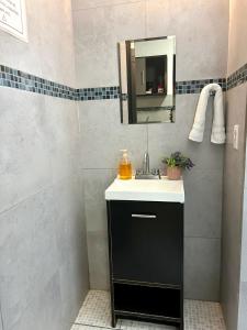a bathroom with a sink and a mirror at Estudio #3 a 10 min del malecon in La Paz +23 photos