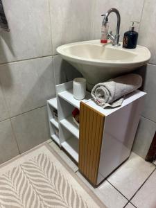 a bathroom with a sink and a white sink at Casa do Bosque in Sao Jose do Rio Preto +26 photos