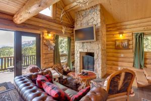 a living room with a couch and a fireplace at Durango Mountain Escape w/ Stunning Views in Durango