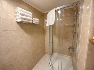 a bathroom with a shower and a glass shower stall at Stay Istanbul Hotel in Istanbul +25 photos