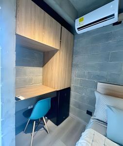 a bedroom with a bed and a desk and a chair at Our Home Granada in Cali +130 photos