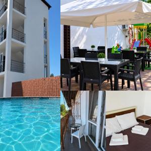 a pool with an umbrella and a table and chairs at Sakura Hotel in Zatoka