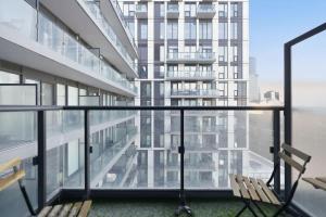 a balcony with a view of a building at Charming 2BR downtown condo with private patio in Toronto