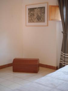 a room with a bed and a suitcase on the floor at Departamento Yotao in Oaxaca City +5 photos