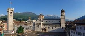 a large building with a clock tower in a city at LeRose in Cadine