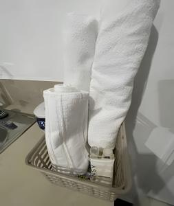 a pile of paper towels in a drying rack at Our Home San Antonio in Cali +225 photos