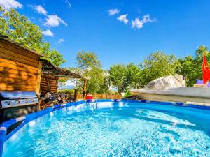 a large plunge pool in the backyard of a house at Le chalet au bord de seine in Les Mousseaux