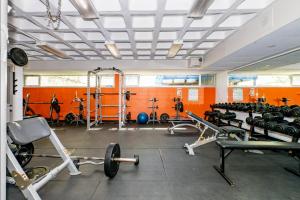 a gym with a lot of equipment in a room at Résidences du Cégep de Rimouski in Rimouski