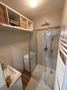 a bathroom with a shower and a toilet and a sink at Ubytovanie u Tomáša in Nesvady +5 photos
