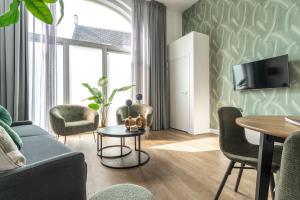 a living room with a couch and chairs and a table at Unique home near Tilburg center, uni & Efteling, in Tilburg +43 photos