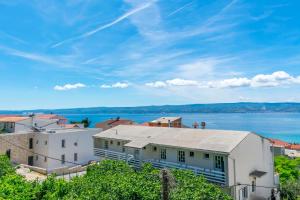 a view of a city and the water at Apartments Adriatic Relax, heated pool, parking place in Duće