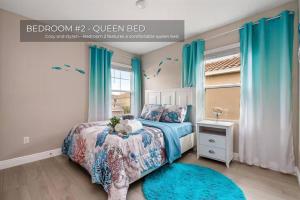 a bedroom with a bed and a window with blue curtains at Spacious 5BR 45BA Home w Pool in Davenport