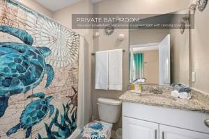 a bathroom with a sink and a shower curtain at Spacious 5BR 45BA Home w Pool in Davenport