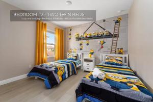 two beds in a room with two twin beds at Spacious 5BR 45BA Home w Pool in Davenport +24 photos