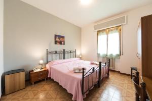 A bed or beds in a room at Albergo Ristorante Poli
