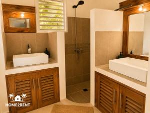 a bathroom with a sink and a shower at Villa 300m from beach with shared swimming pool in Las Terrenas +27 photos