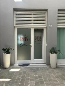 a large glass door with the words bar office on it at Chloè Vacanze in Iesi