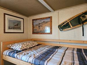 a bedroom with a bed in a room at Hidden Creek Cabin in Beaverlodge