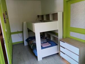 a bunk bed in a room with a closet at Le Flocon in Prémanon