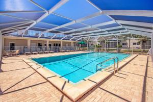 a large swimming pool with an open roof at Unit D2 in Sanibel