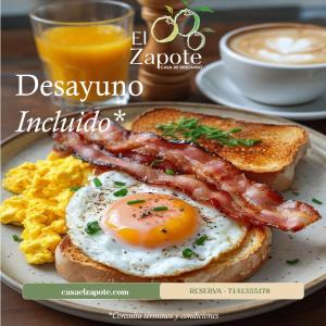 a breakfast plate with eggs bacon and toast and coffee at El Zapote Casa de Descanso in Malinalco
