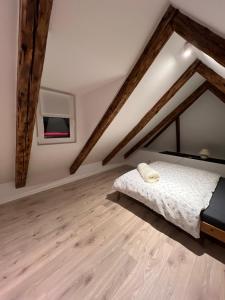a bedroom with a bed and wooden floors at Zimmer in Wattenbek in Wattenbek
