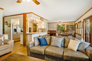 a living room with a couch and a kitchen at Angel View in Cullowhee