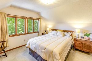 a bedroom with a large bed and a window at Grin and Bear It in Whittier +19 photos
