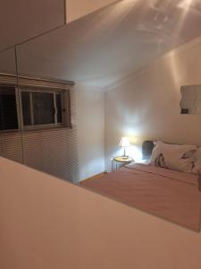 a bedroom with a bed and a window at House Heart in Amora