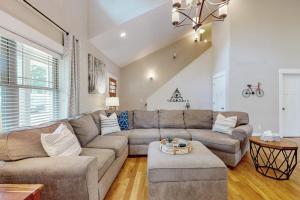 a living room with a couch and a table at Noble Sun in Fairview