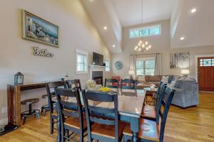 a kitchen and living room with a table and chairs at Noble Sun in Fairview