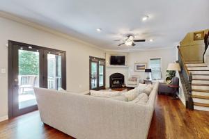a living room with a couch and a fireplace at The Marlin in Arden