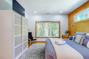 a bedroom with a large bed and a window at The Lime House in Brevard
