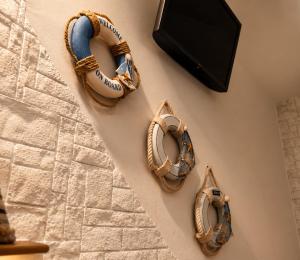 a group of baseball mitts hanging on a wall at Carbonari Holiday House in Cefalù