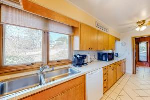 a kitchen with a sink and a window at Morris Villa Upper in Lake Junaluska