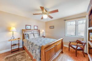 a bedroom with a bed and a ceiling fan at Morris Villa Upper in Lake Junaluska