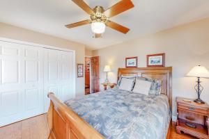 a bedroom with a bed and a ceiling fan at Morris Villa Upper in Lake Junaluska +22 photos